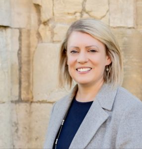 Image is a head shot of Rebecca Burrows.